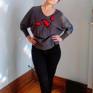 Batwing sweater with red detail